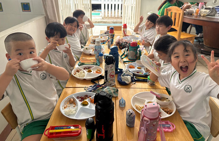 Children enjoying lunch together